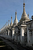 Myanmar - Mandalay, Sandamuni Pagoda. The entire ground is covered with 1749 small white pagodas with stone slabs with the Buddhist Tripitaka. 